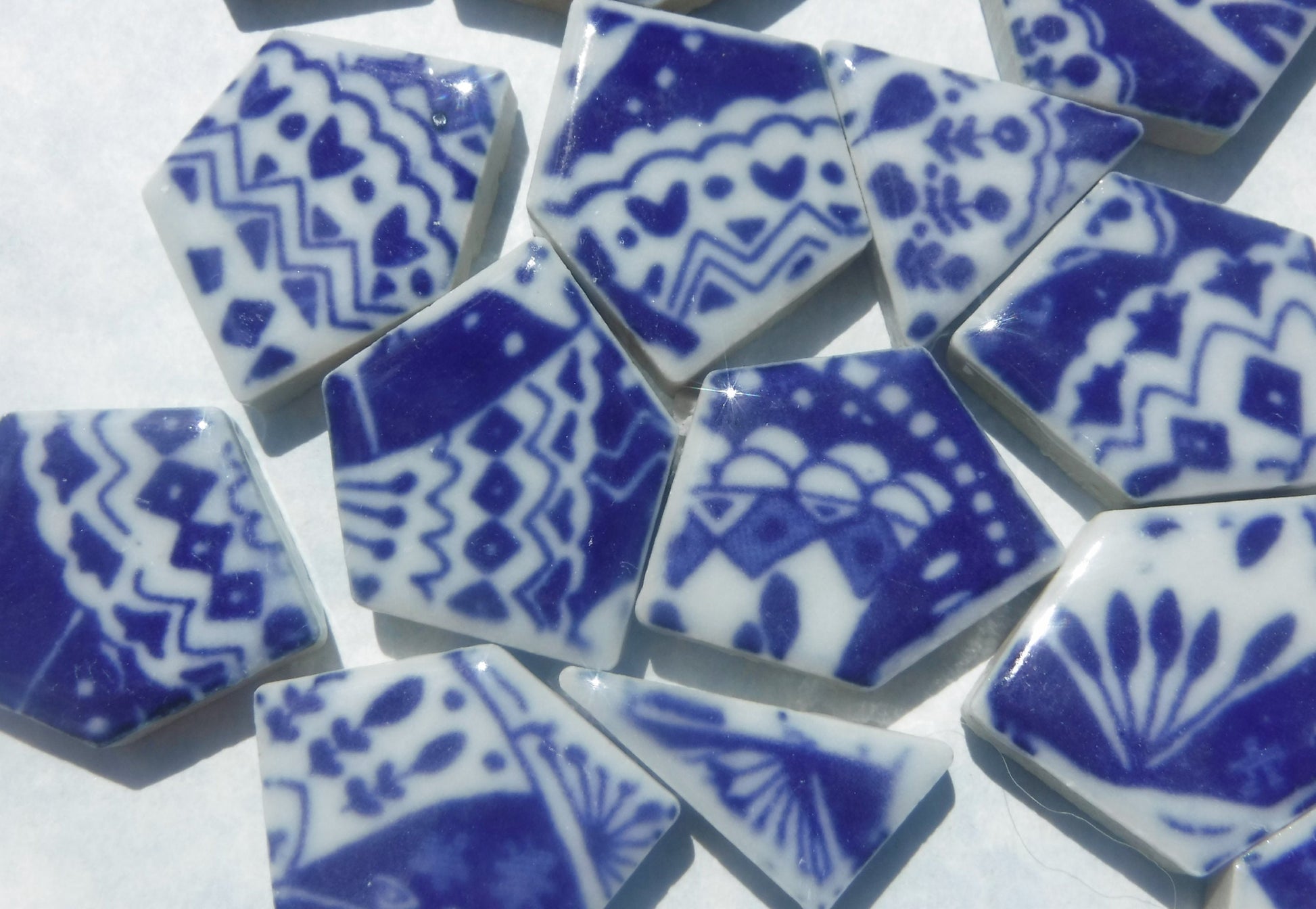 White Decorative Details on Deep Blue Chunky Porcelain Mosaic Tiles - Half Pound