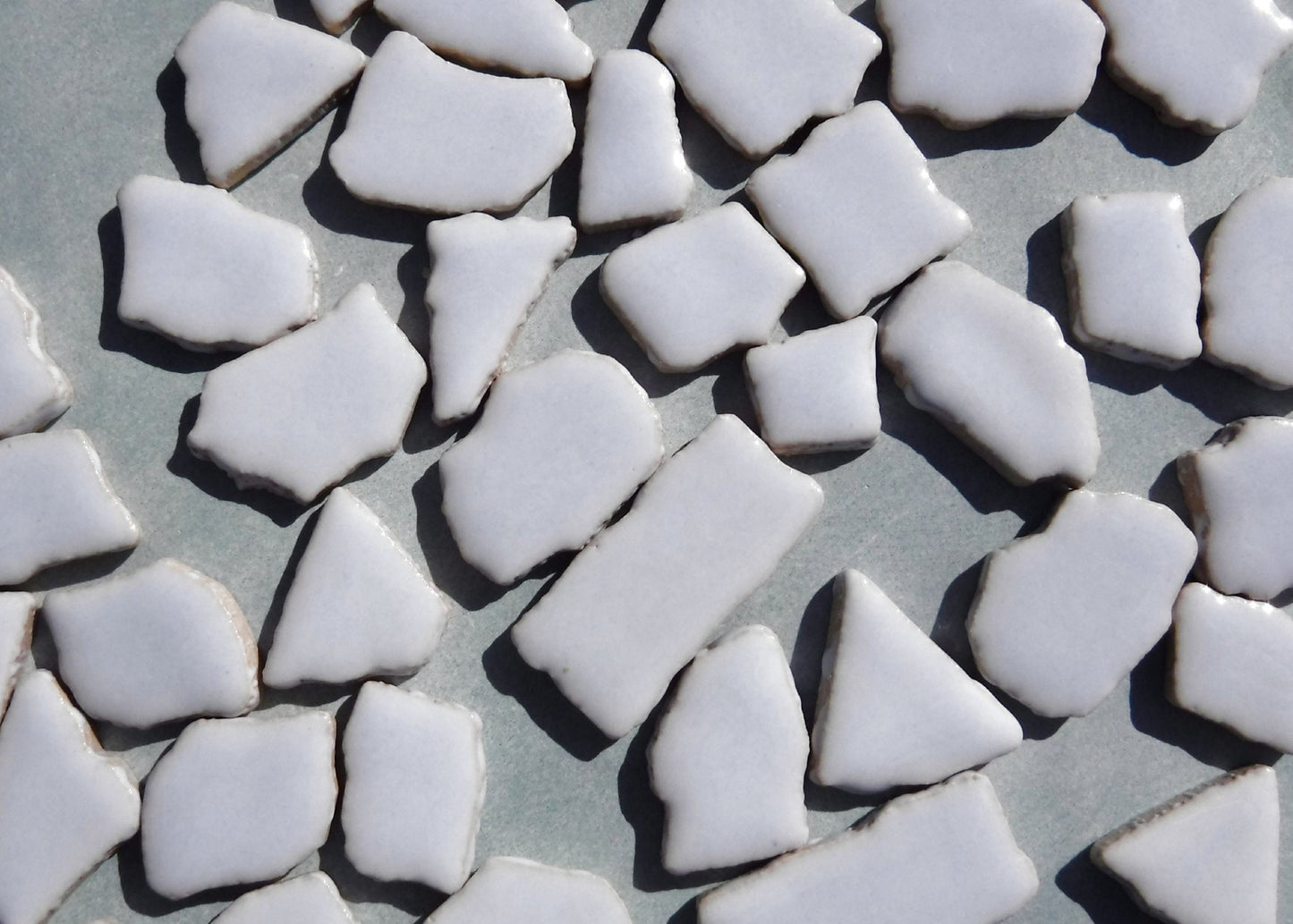 Ice Blue Mosaic Ceramic Tiles - Jigsaw Puzzle Shaped Pieces - Half Pound - Assorted Sizes Random Shapes in Very Pale Blue
