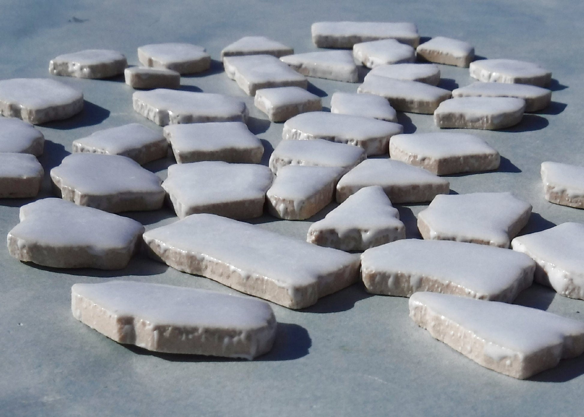 Ice Blue Mosaic Ceramic Tiles - Jigsaw Puzzle Shaped Pieces - Half Pound - Assorted Sizes Random Shapes in Very Pale Blue