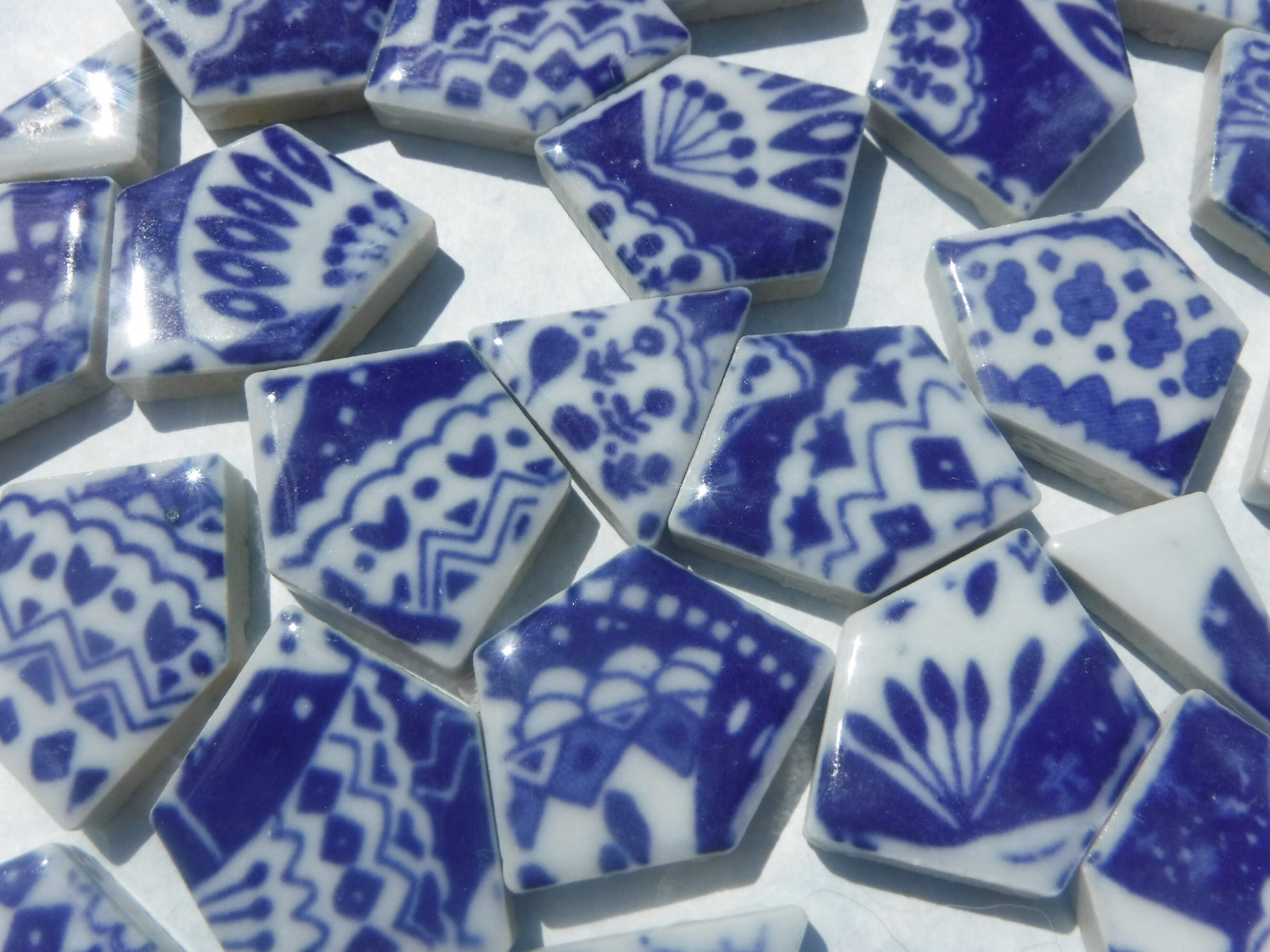 White Decorative Details on Deep Blue Chunky Porcelain Mosaic Tiles - Half Pound