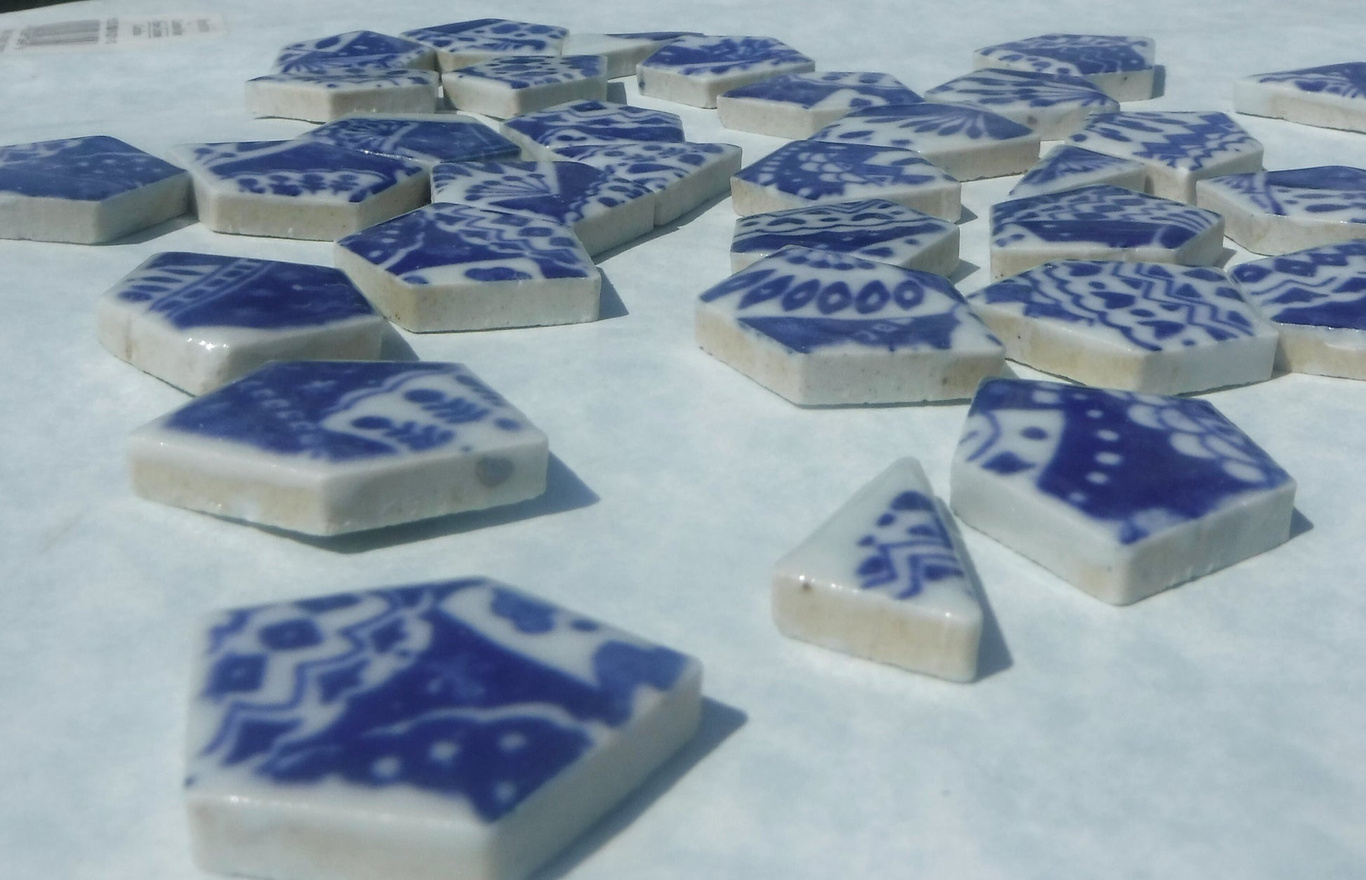 White Decorative Details on Deep Blue Chunky Porcelain Mosaic Tiles - Half Pound